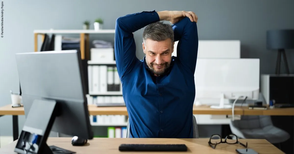 Office worker pausing for a brief stretch between tasks